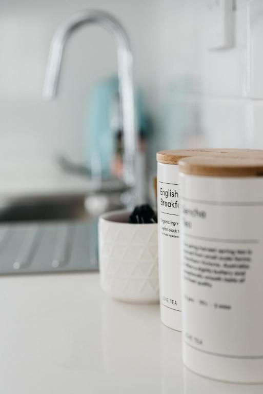 two cups of coffee sitting on a kitchen counter at Anchor Geelong in Geelong
