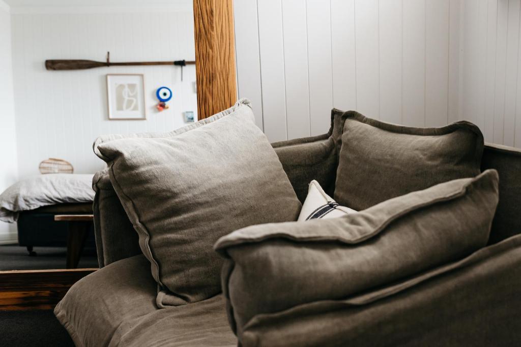 a couch with pillows on it in a living room at Anchor Geelong in Geelong