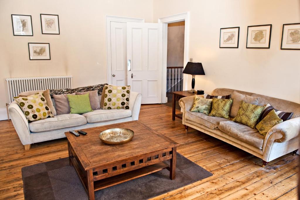 a living room with two couches and a coffee table at Haddington Place in Edinburgh