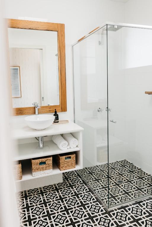 a bathroom with a sink and a glass shower at Anchor Geelong in Geelong