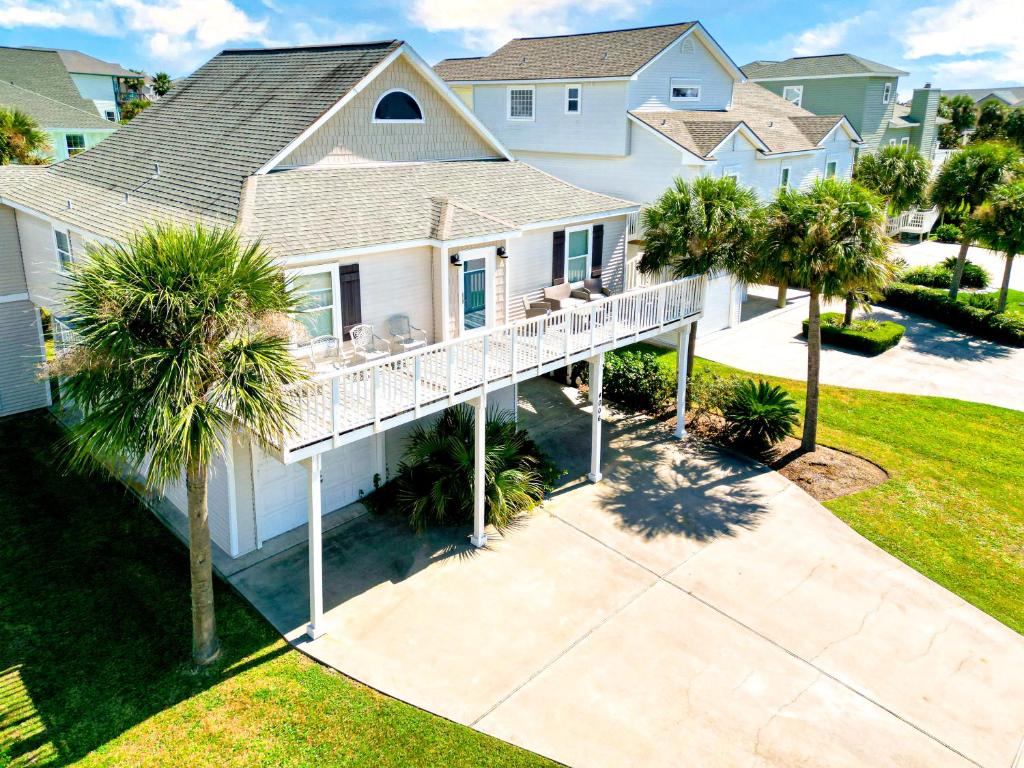 an aerial view of a house with palm trees at Enjoy Our Ocean Oasis in Galveston