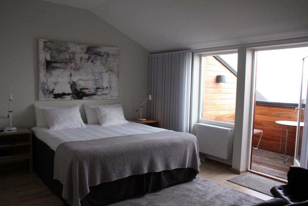 Postel nebo postele na pokoji v ubytování Kiviks Hotell
