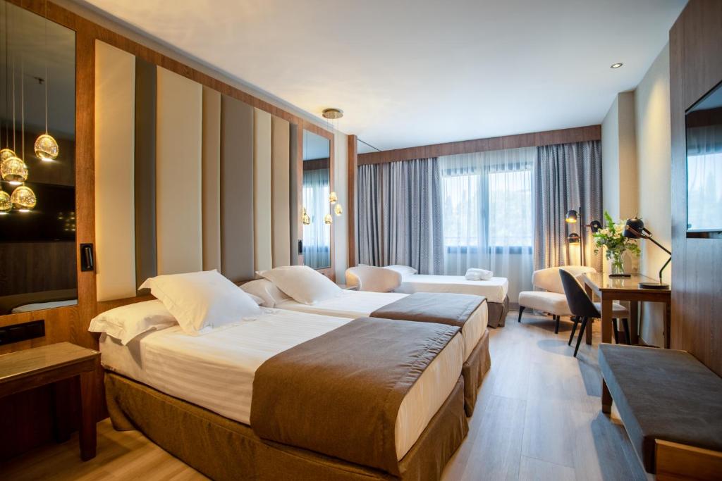 Postel nebo postele na pokoji v ubytování Hotel Granada Center