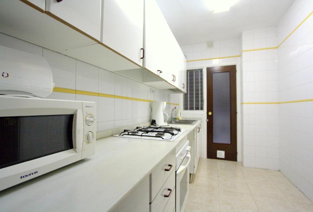 Kuchyňa alebo kuchynka v ubytovaní La Pedrera Residence