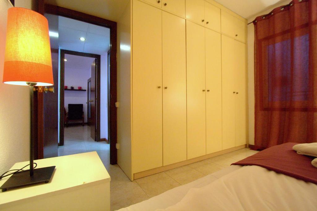 Posteľ alebo postele v izbe v ubytovaní La Pedrera Residence
