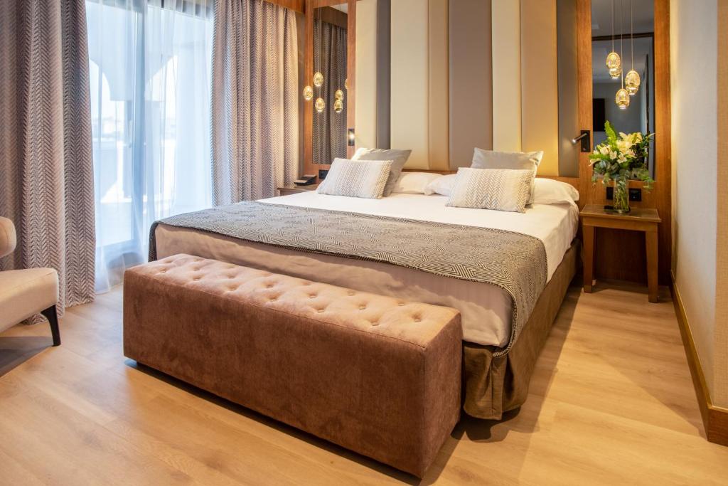 Postel nebo postele na pokoji v ubytování Hotel Granada Center