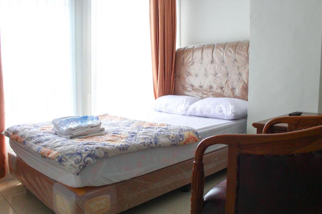 Postel nebo postele na pokoji v ubytování Brahma Hotel Mitra RedDoorz