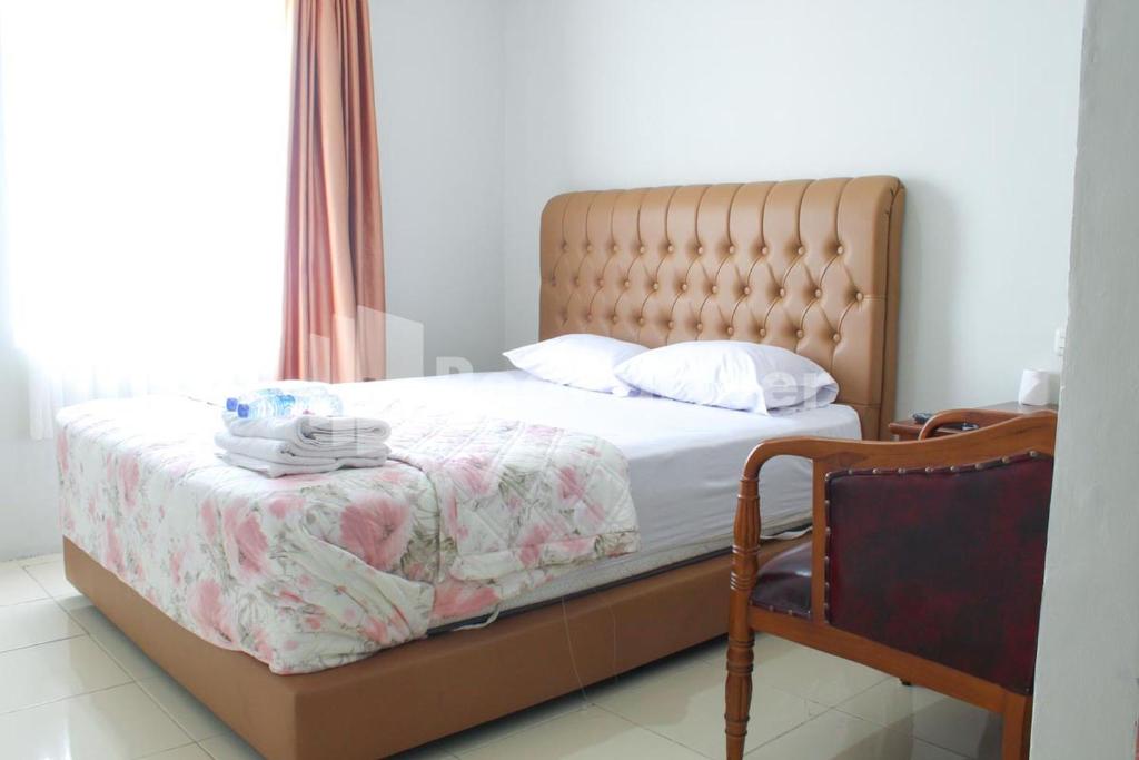 Postel nebo postele na pokoji v ubytování Brahma Hotel Mitra RedDoorz