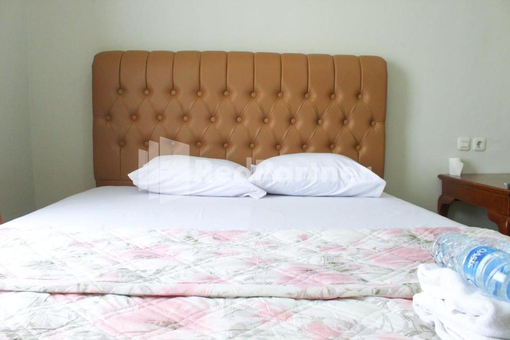 Postel nebo postele na pokoji v ubytování Brahma Hotel Mitra RedDoorz