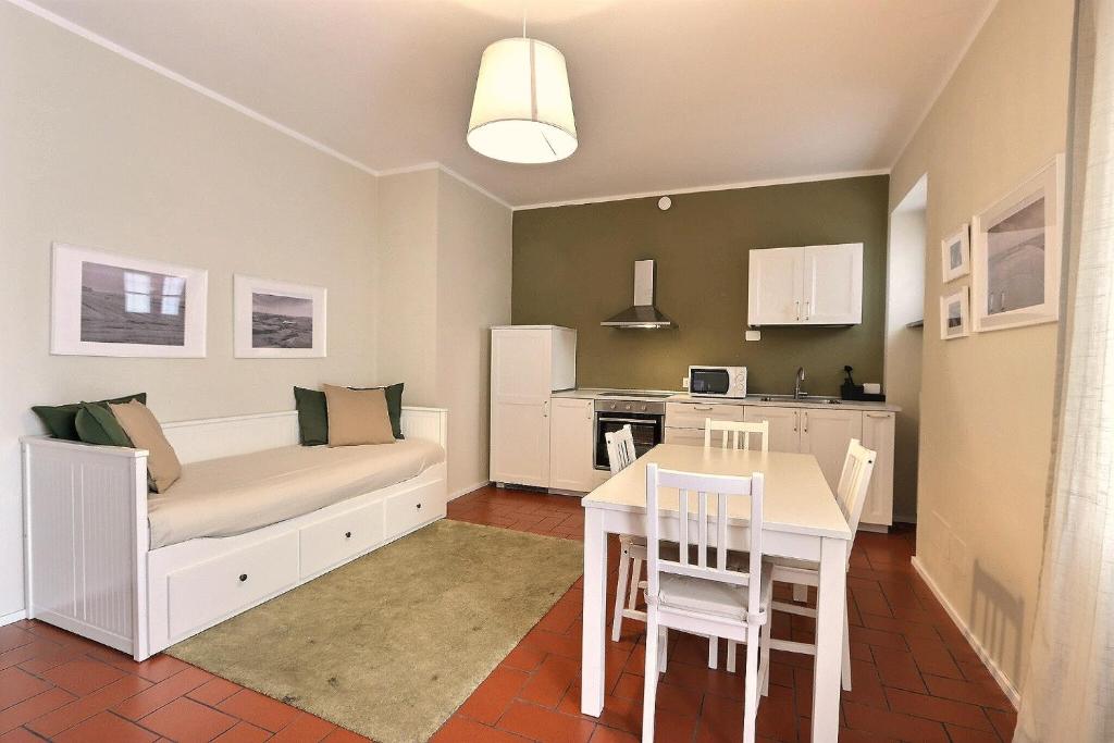 a living room with a couch and a table at Residence il Cascinetto in Pavia
