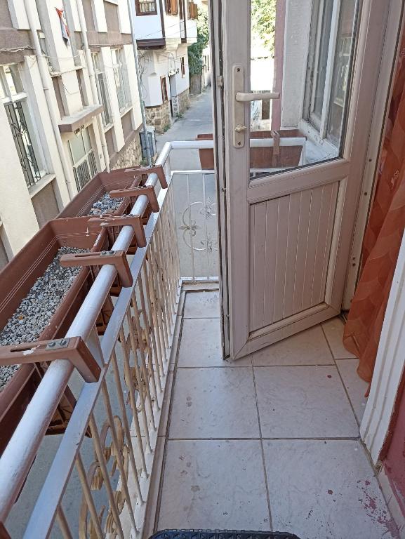 an open door on a balcony with an open door at EVA GOLD APART in Antalya