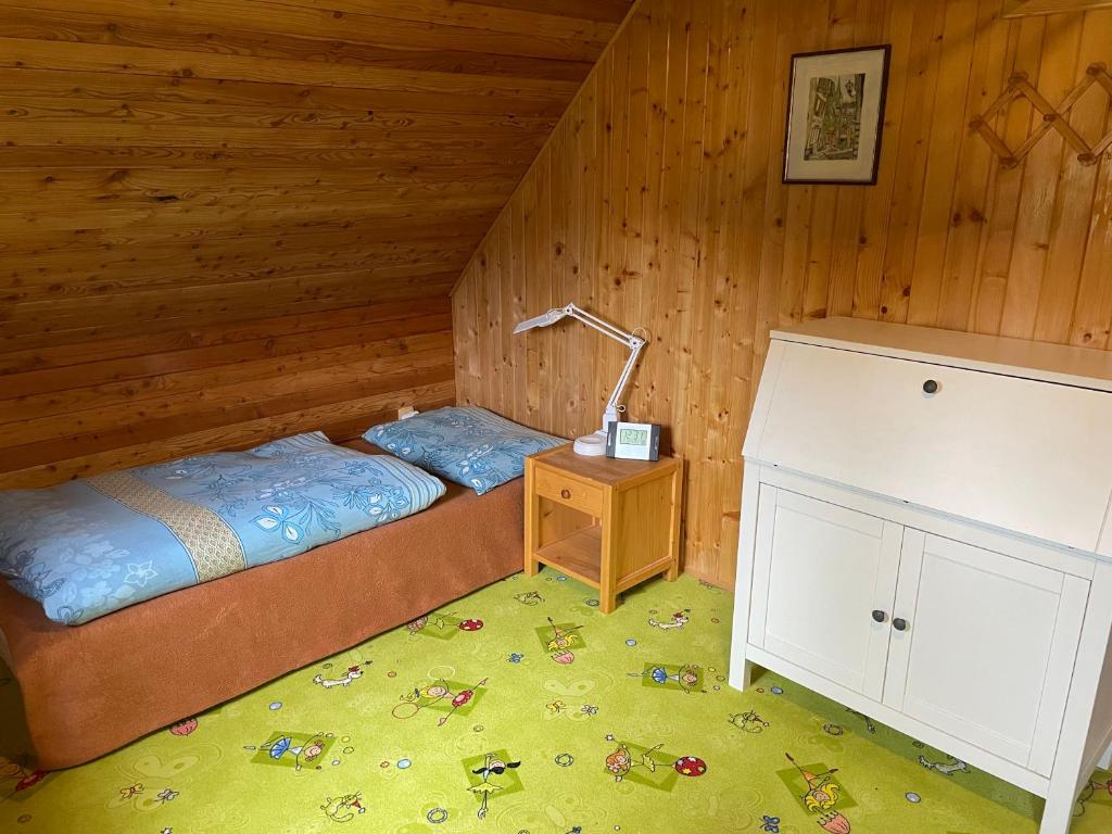 Postel nebo postele na pokoji v ubytování Horská chalupa Pluskovjanka