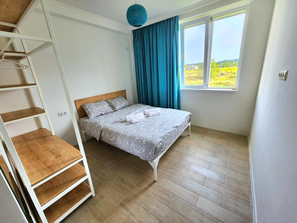 Postel nebo postele na pokoji v ubytování beachfront apartments ,,kapro-one,,