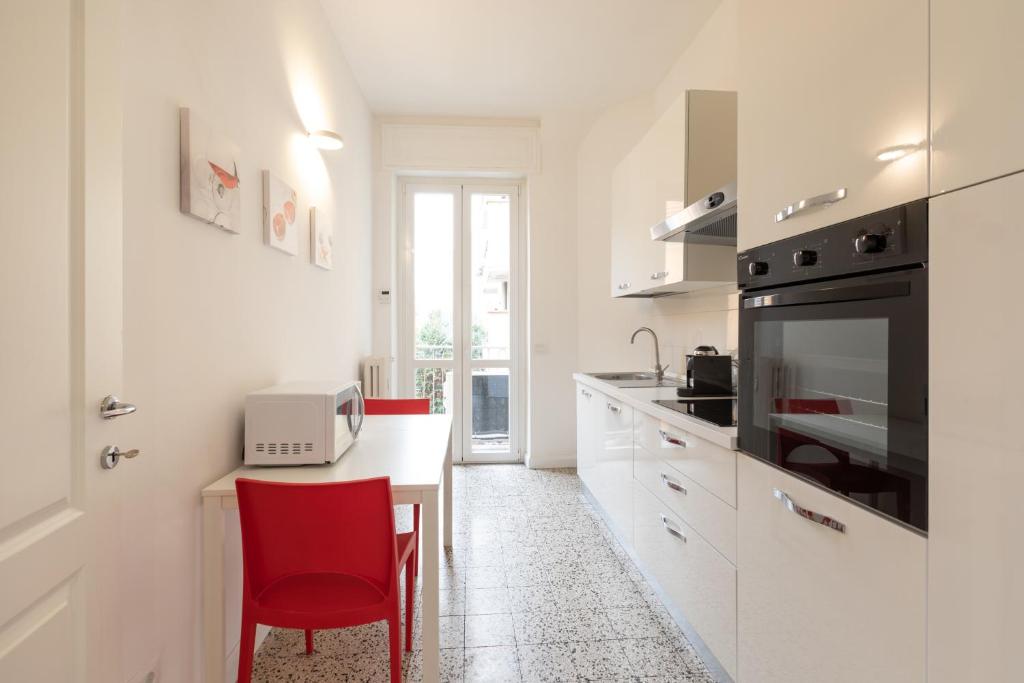 A kitchen or kitchenette at Gaffurio Apartments