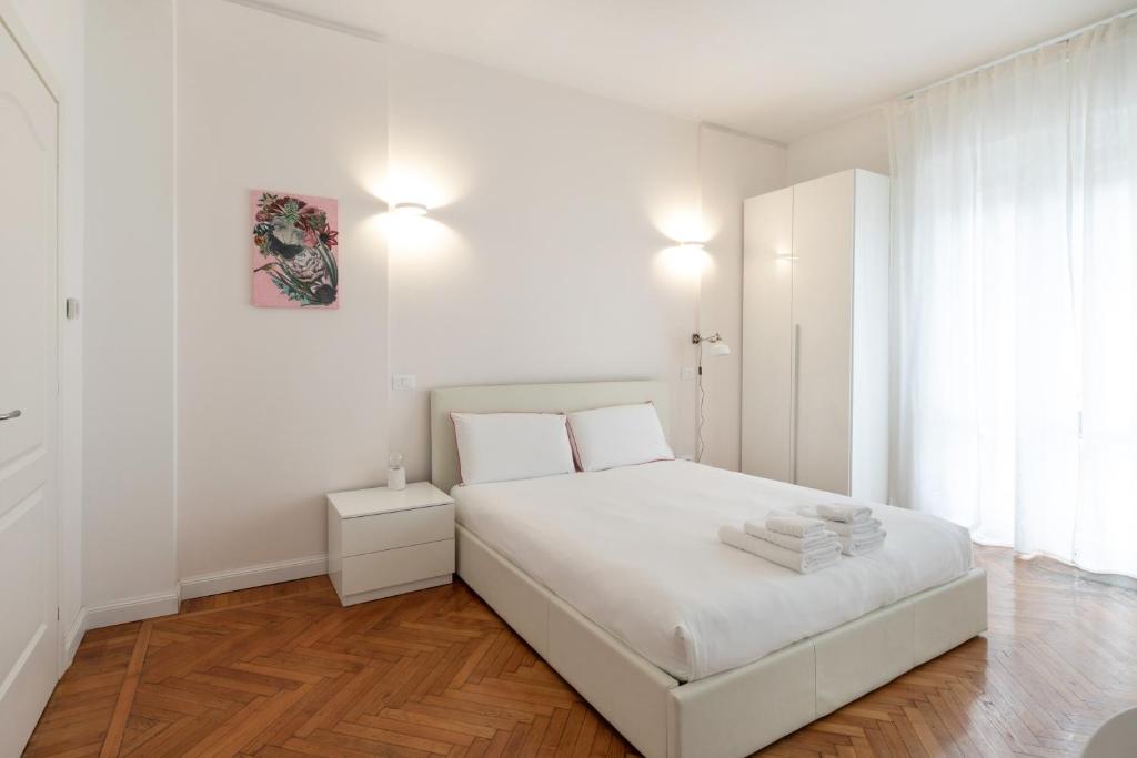 A bed or beds in a room at Gaffurio Apartments