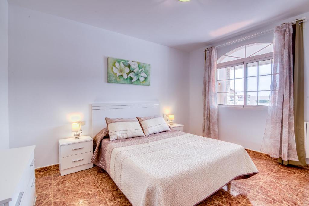 A bed or beds in a room at Chalet Villa Bonavista