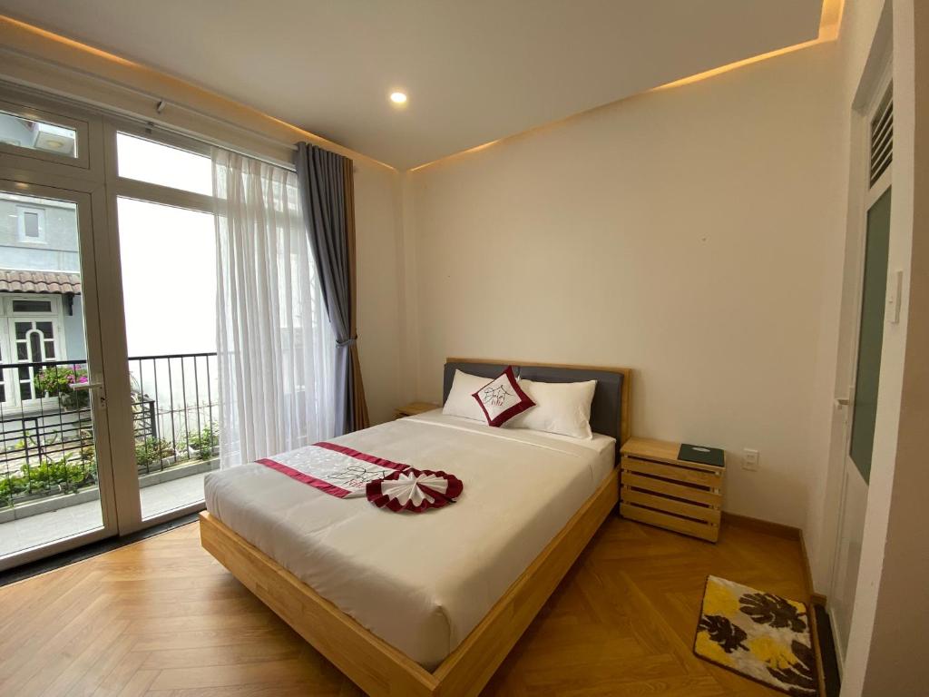 Giường trong phòng chung tại Feliz Dalat Homestay