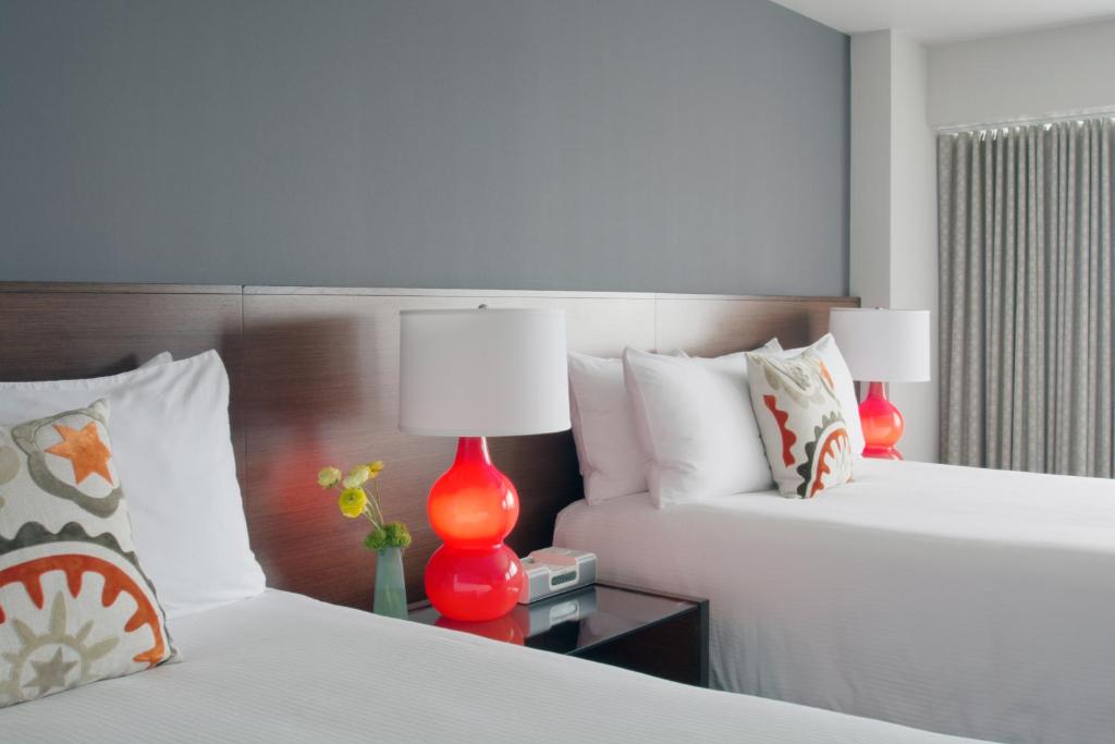 Voodi või voodid majutusasutuse Hotel Murano toas