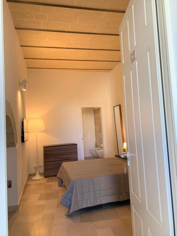 Postel nebo postele na pokoji v ubytování Albergo Del Sedile