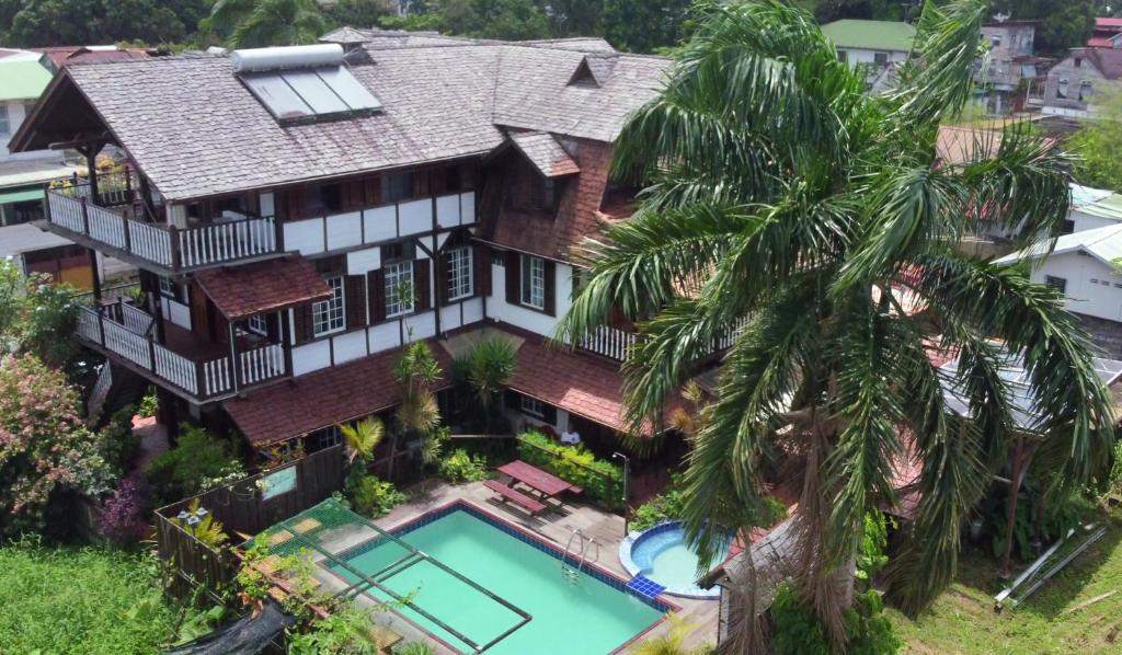 an aerial view of a house with a swimming pool at Greenheart Boutique Hotel in Paramaribo