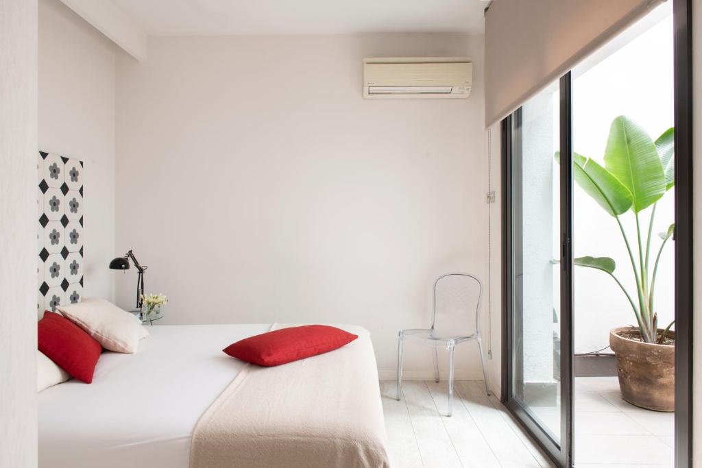 Postel nebo postele na pokoji v ubytování Eric Vökel Boutique Apartments - BCN Suites