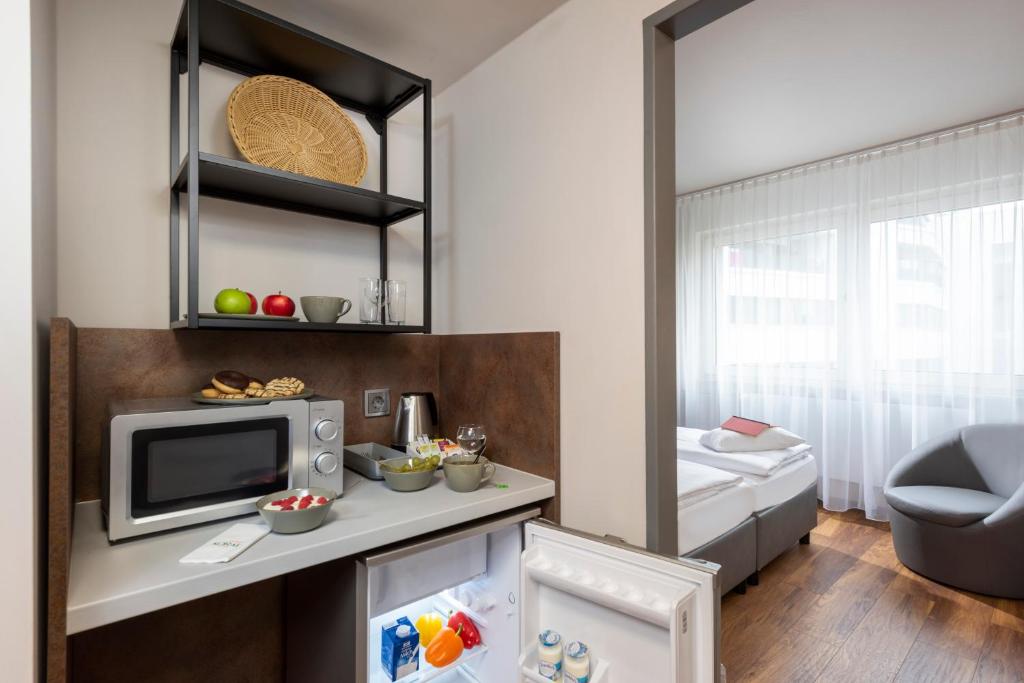 Postel nebo postele na pokoji v ubytování SORAT Hotel Berlin
