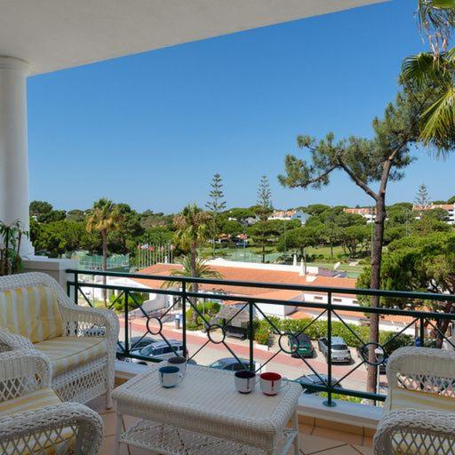 a balcony with chairs and a table and a view at Apartment Kairi in Vale do Lobo