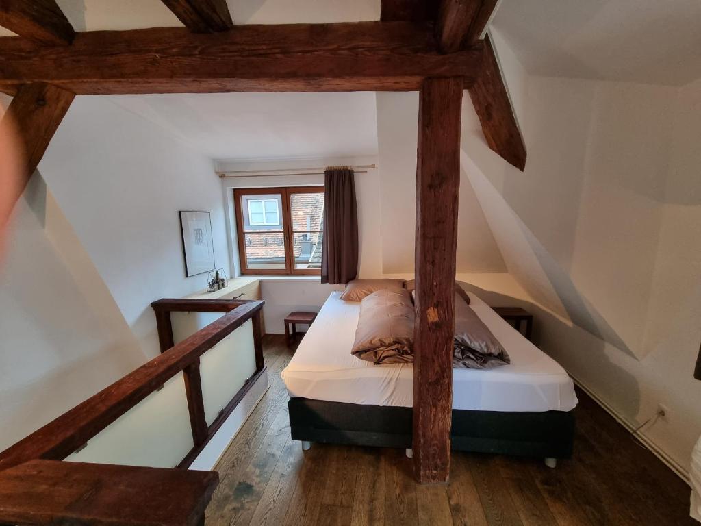 a bedroom with a bed in a attic at Appartment Montfort in Feldkirch