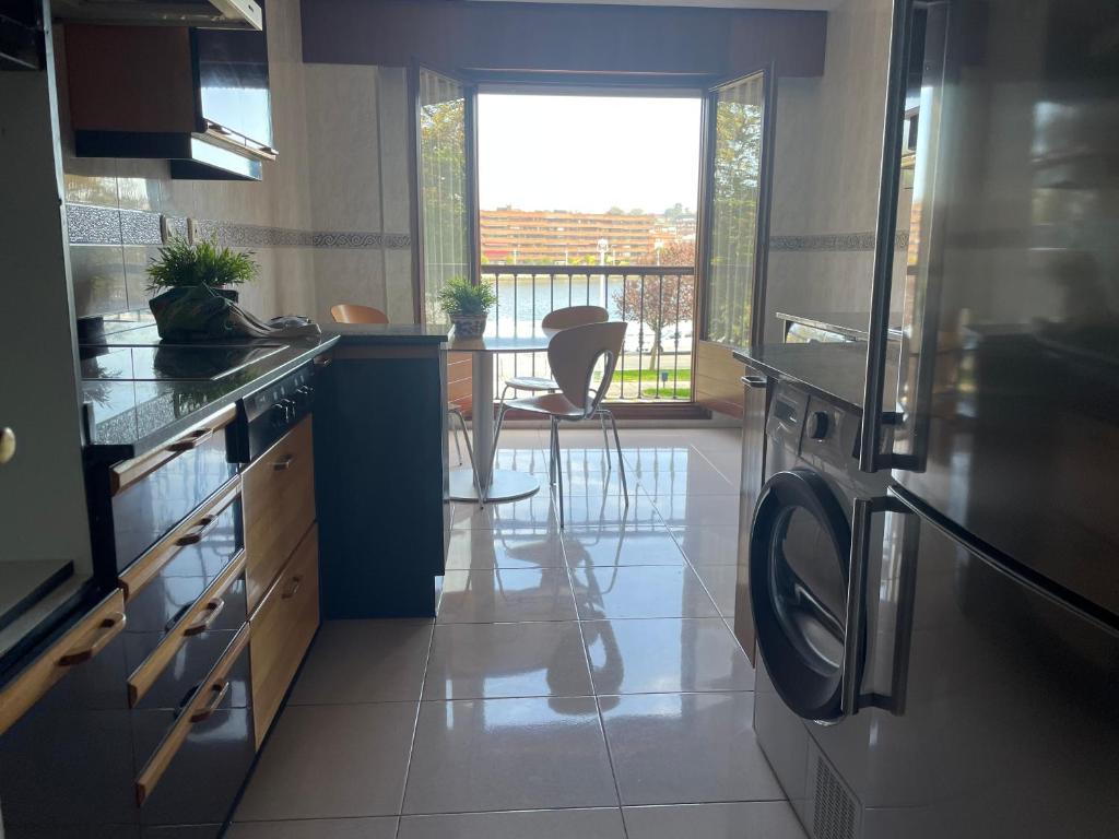 Kuchyň nebo kuchyňský kout v ubytování RIVER SUITE Apartment
