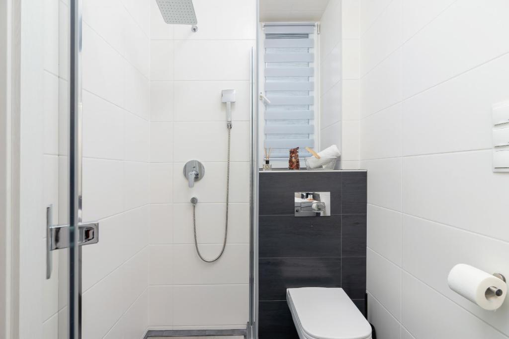 Kúpeľňa v ubytovaní Kraków Trendy Studio Apartments by Noclegi Renters