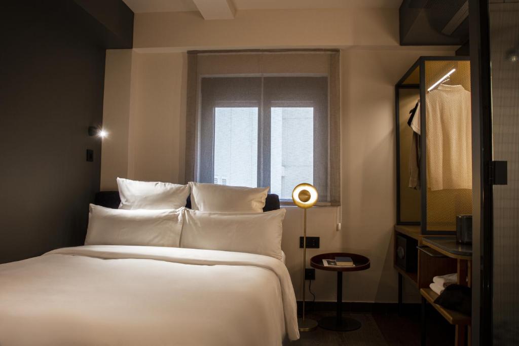 A bed or beds in a room at Letoh Letoh Gran Vía