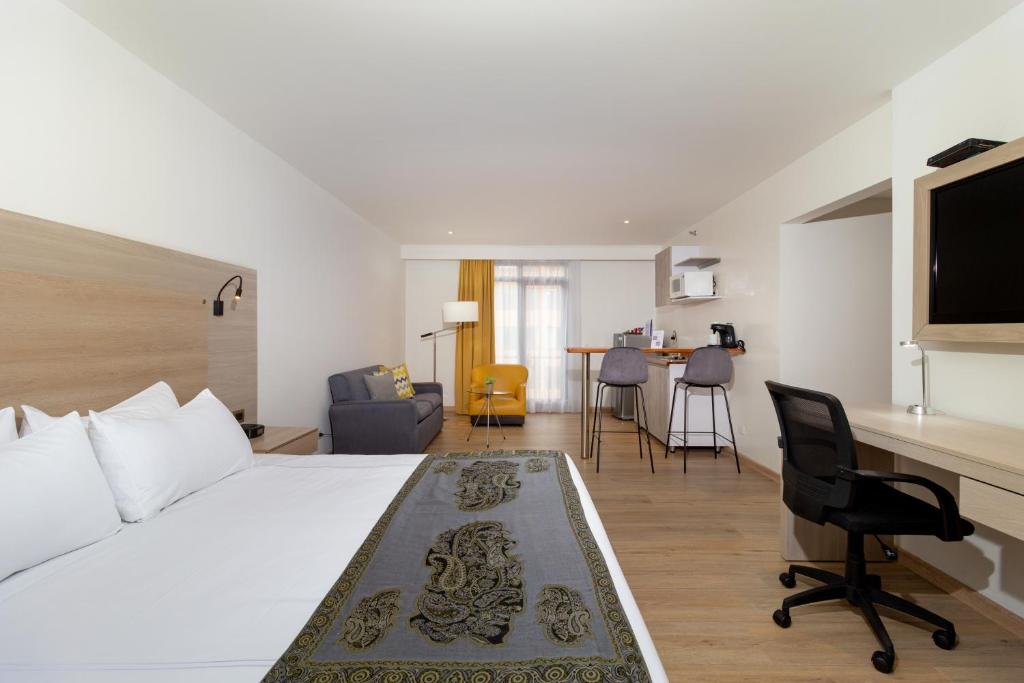 Postel nebo postele na pokoji v ubytování Hotel Rosales Plaza