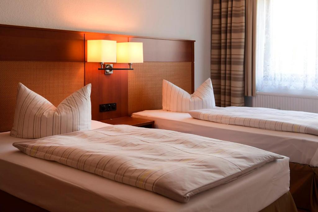 Voodi või voodid majutusasutuse Olympia Hotel Suhl toas