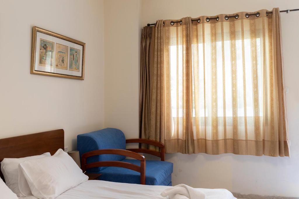 Postel nebo postele na pokoji v ubytování Port Inn