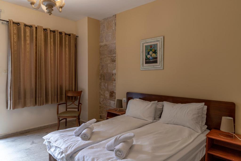 Postel nebo postele na pokoji v ubytování Port Inn