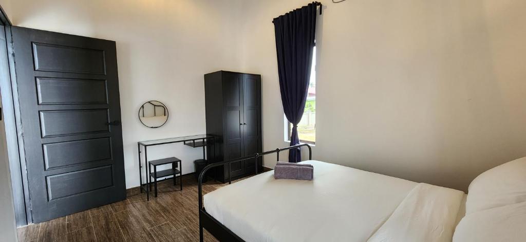Postel nebo postele na pokoji v ubytování Kamalia Villas