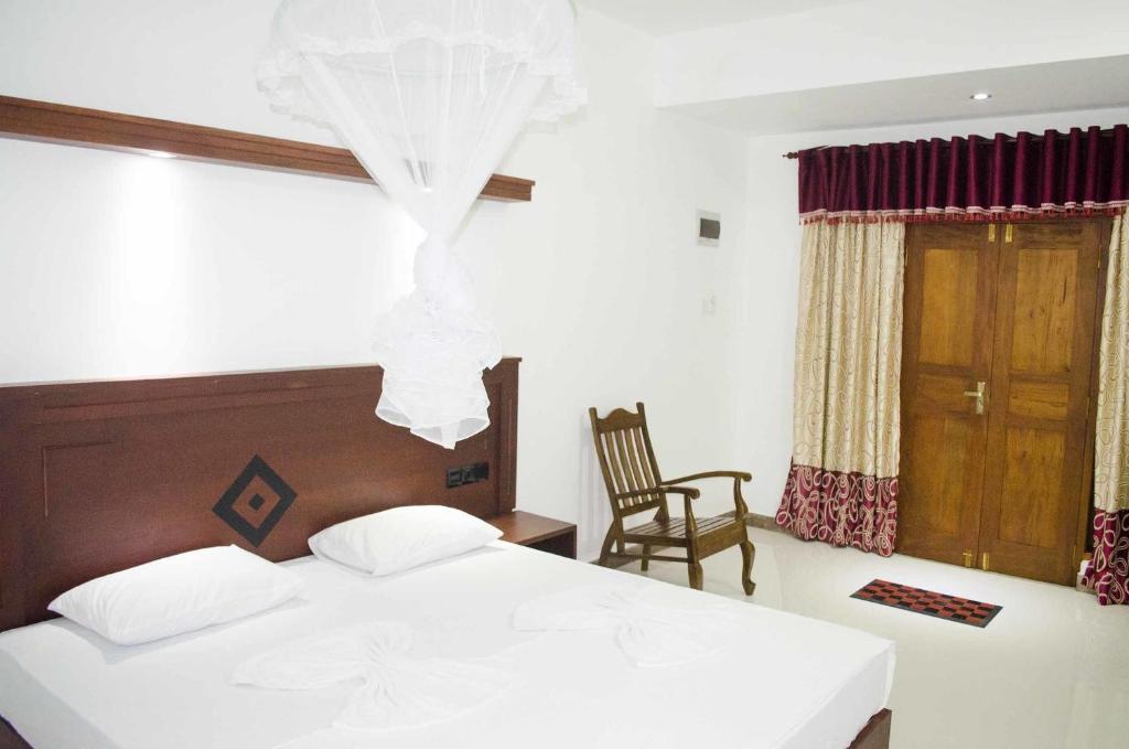 Postel nebo postele na pokoji v ubytování Suwa Arana Resort