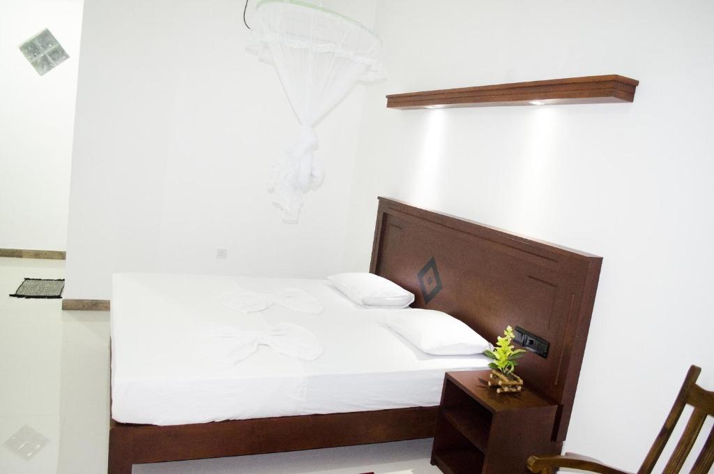 Postel nebo postele na pokoji v ubytování Suwa Arana Resort