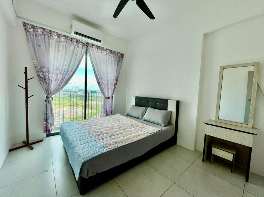a bedroom with a bed with a window and a mirror at Meritus Studio Holiday (Perai) in Perai