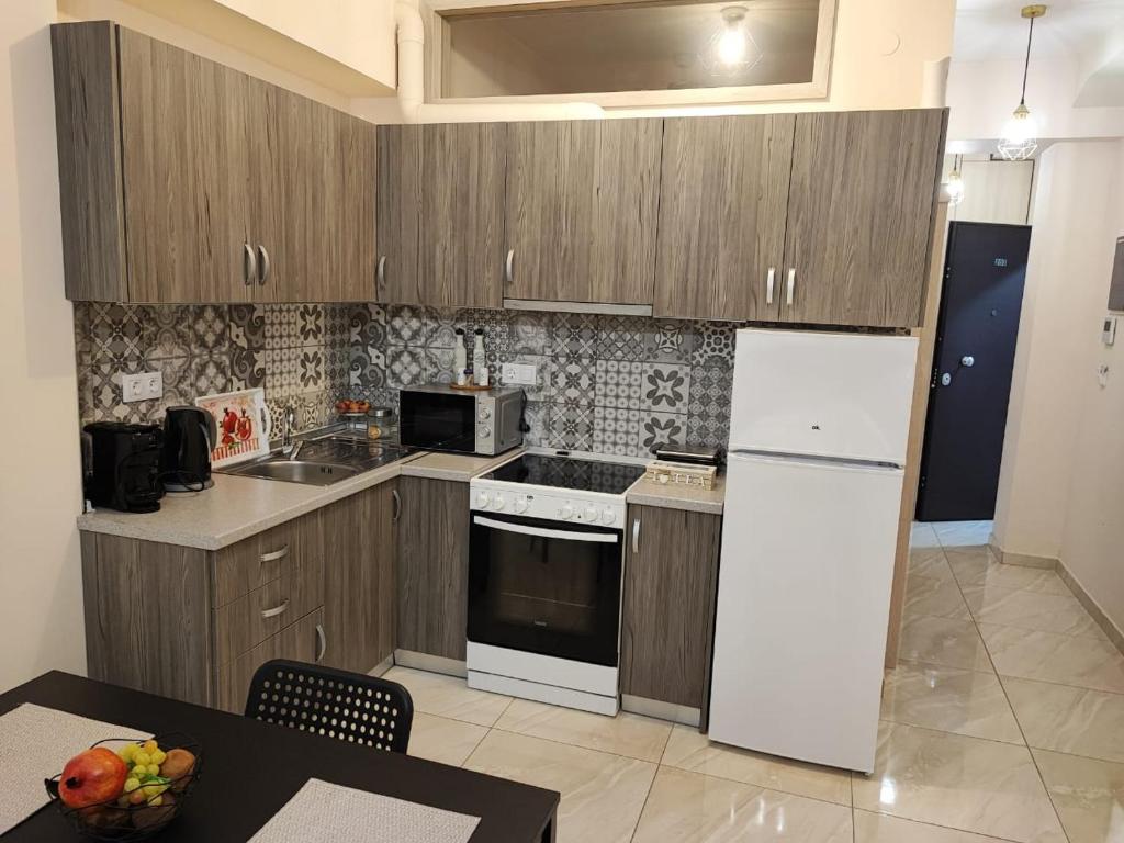 Kuchyň nebo kuchyňský kout v ubytování G&M Luxury Studios