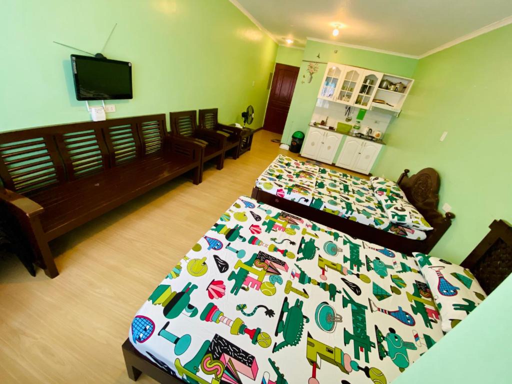 Postel nebo postele na pokoji v ubytování Albergo Hotel - Studio Condo Unit - Baguio Transient