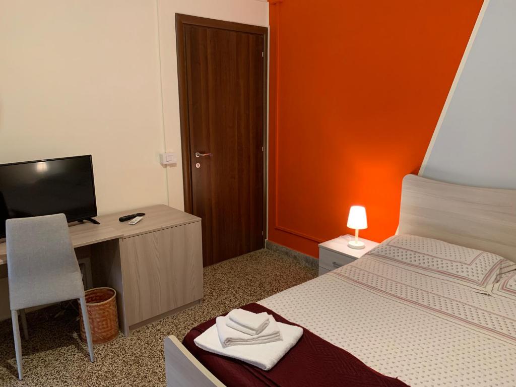 Postel nebo postele na pokoji v ubytování Erythrà Bed and Breakfast