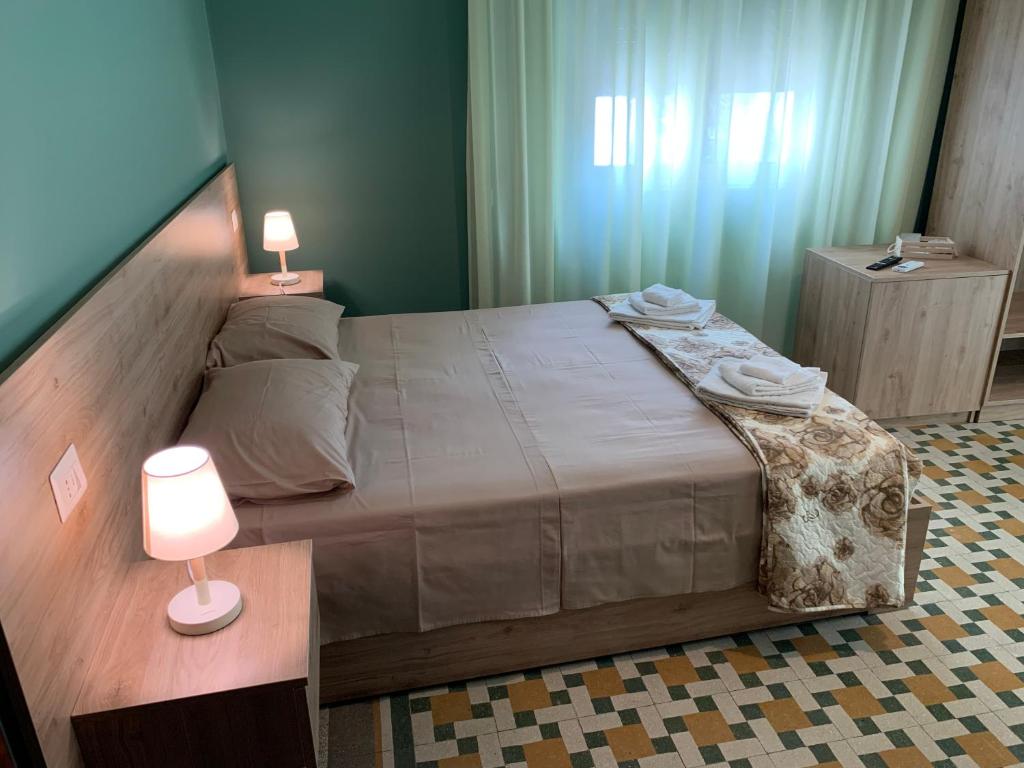 Postel nebo postele na pokoji v ubytování Erythrà Bed and Breakfast