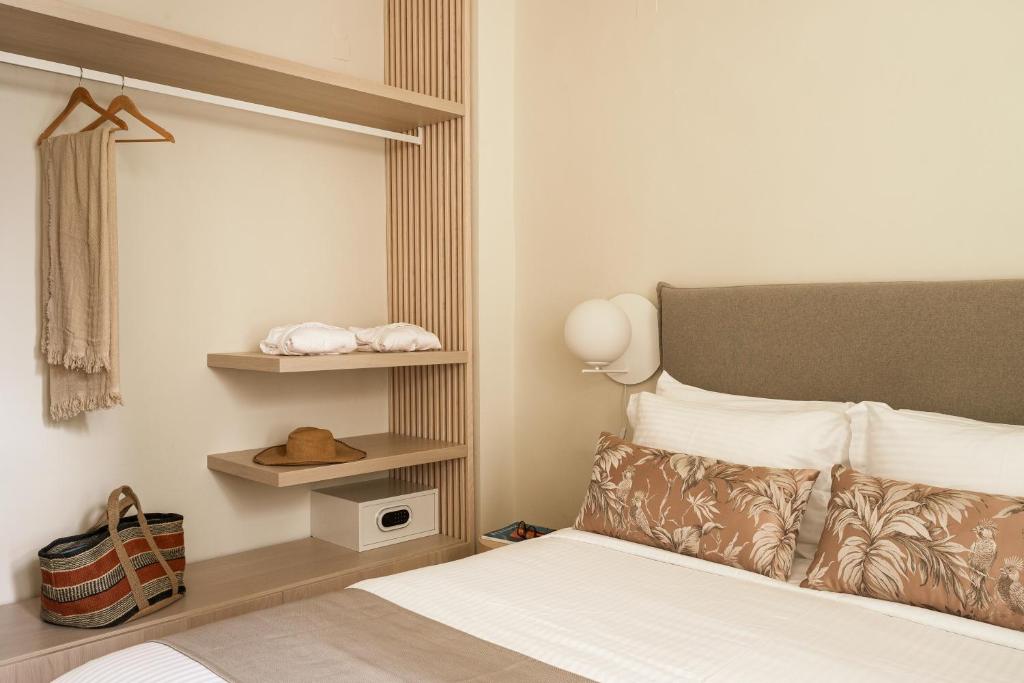 a hotel room with a bed and ahatternessterness at SYROS SOUL LUXURY SUITES in Ermoupoli