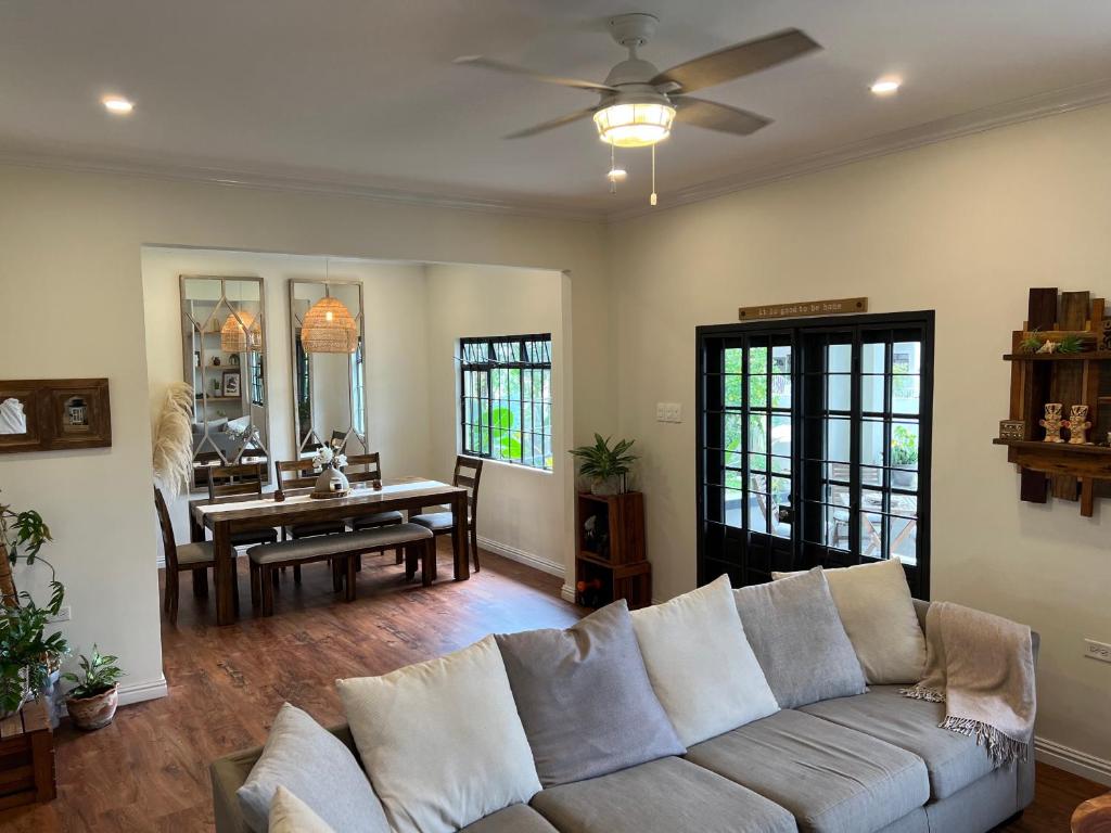 a living room with a couch and a table at Westend House Newly Renovated 3 Bedroom in Petit Valley