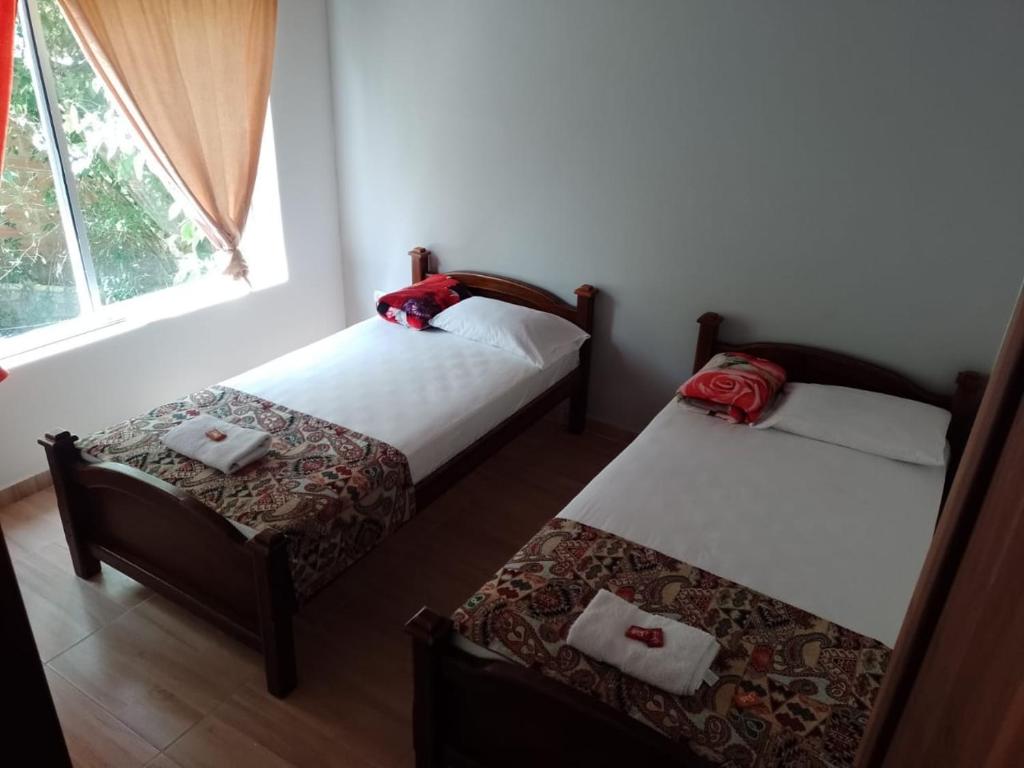 Voodi või voodid majutusasutuse Sendero del Rio Finca Hotel toas