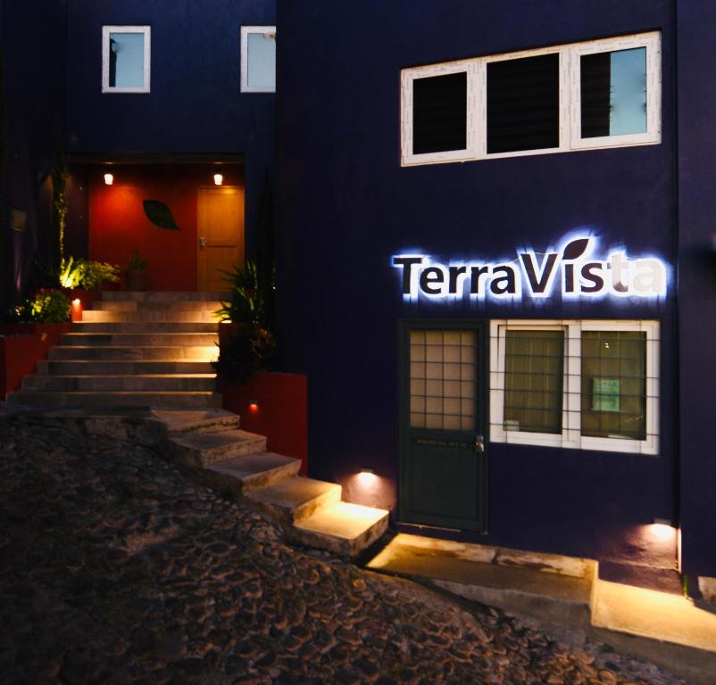 a blue building with a sign on the side of it at Terra Vista in Guanajuato