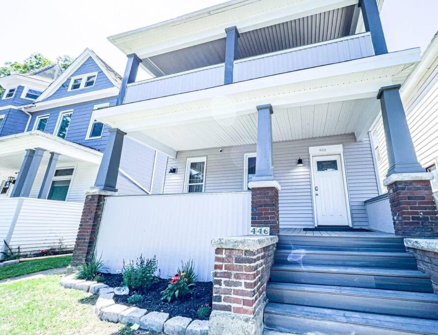 a house with a staircase leading up to a door at The Haines Villa in Niagara Falls