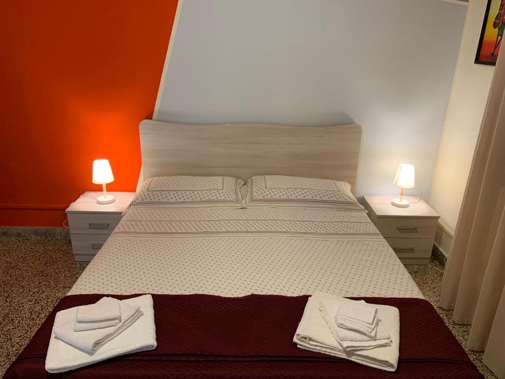 Postel nebo postele na pokoji v ubytování Erythrà Bed and Breakfast