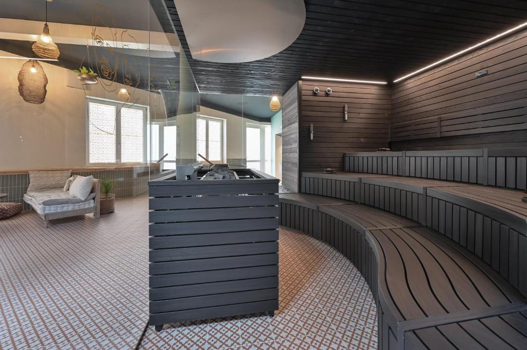 a waiting room with a counter and a bench at Hotel Sonne in Füssen